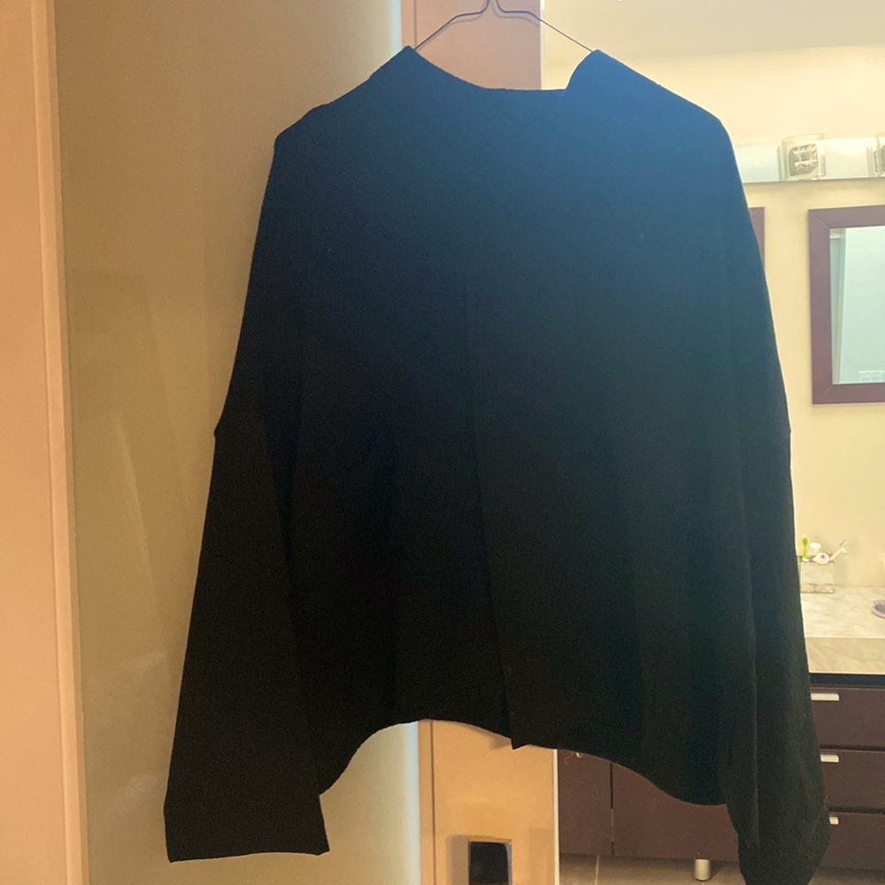 Very cool and unique sweater. Half virgin wool and the other half merino wool.